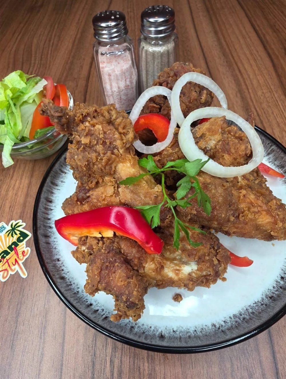 Fried chicken with peppers and onions