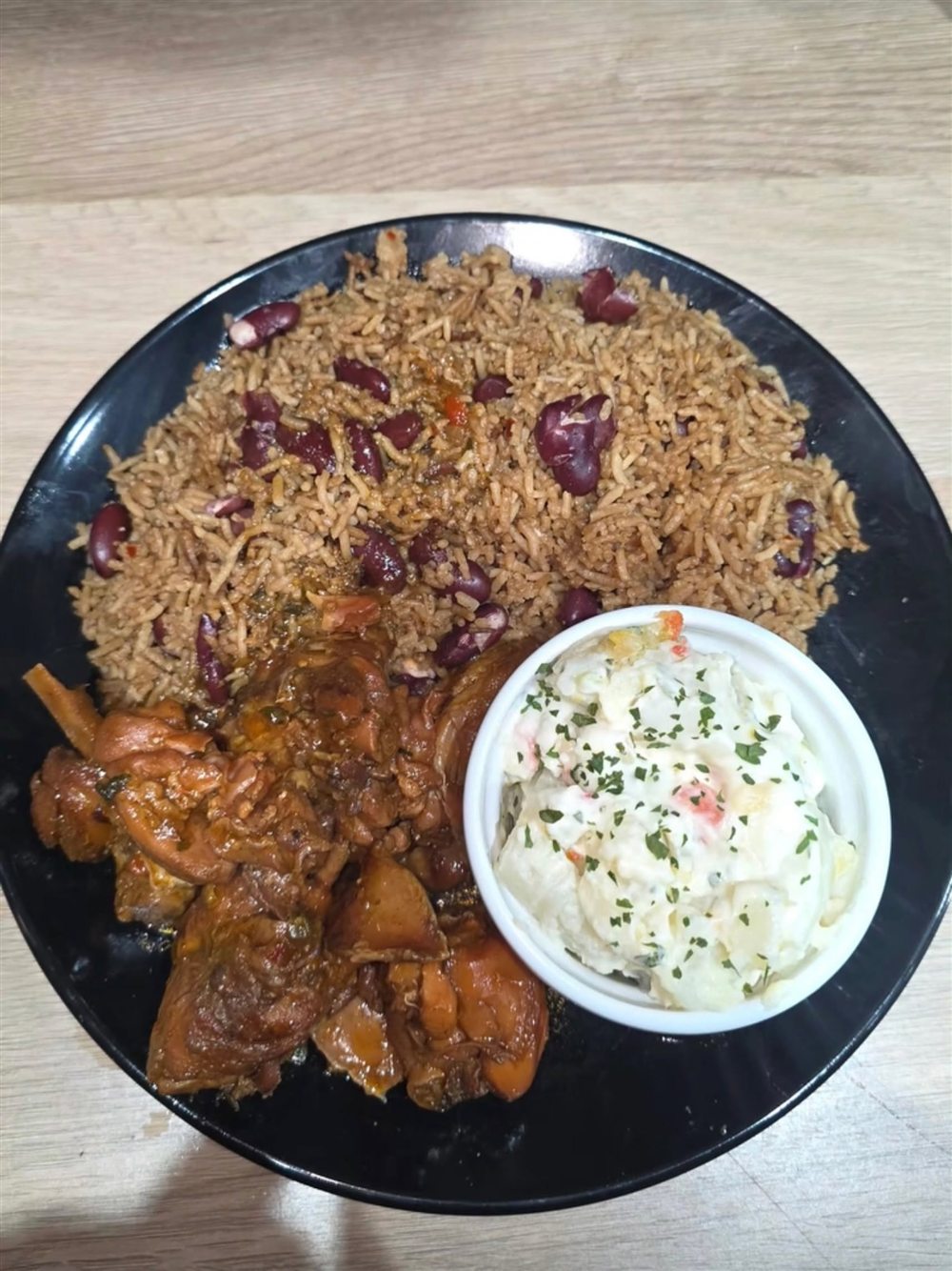 Rice and peas with meat and coleslaw