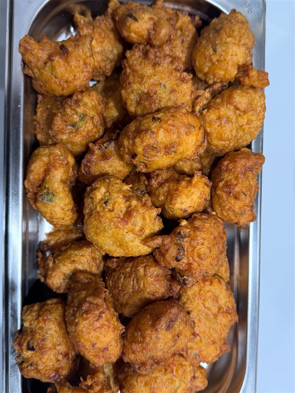A catering tray of fritters